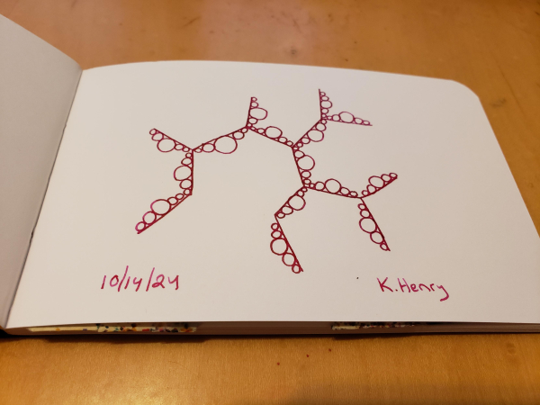 Hand drawn genertive/procedural art in ink on an open page of my sketchbook. The abstract pattern has straight lines at angles, and circles along the lines...kind of like bubbles.