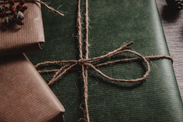 green box tied with brown string representing gift ideas for visually impaired