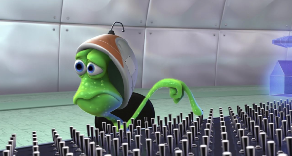 Still from the Pixar short “Lifted” showing an alien with a forlorn expression, trying to make sense of the vast array of switches before them.