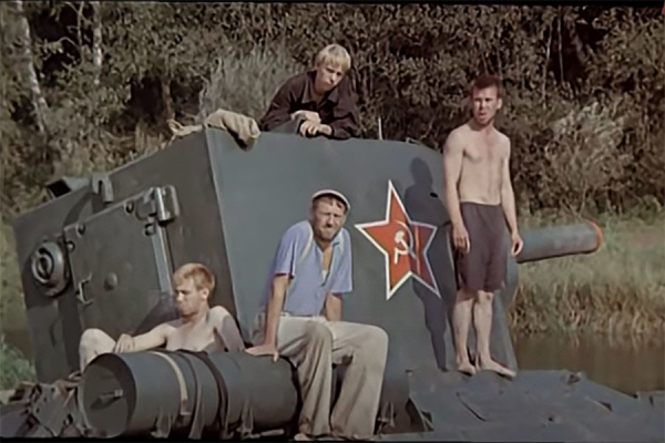 People sitting on a tank