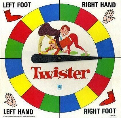 A Twister game spinner.
Right hand red
  Left foot blue
Right foot yellow
  Left hand you