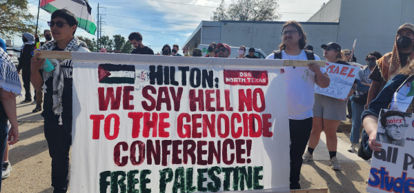 Banner: Hilton: We Say Hell No To The Genocide Conference! Free Palestine 