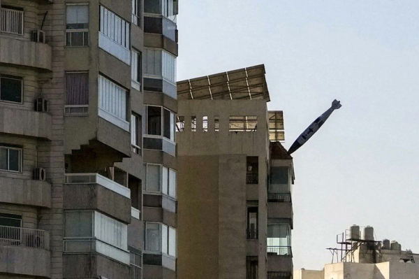 A 2000lb bomb is seen silently gliding towards a set of mid/high rise buildings. The bomb was captured by the photographer mere feet from a building, moments before exploding.