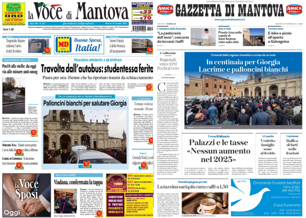 L'immagine mostra due prime pagine di giornali affiancate. A sinistra c'è "La Voce di Mantova" e a destra "Gazzetta di Mantova".   Sulla prima pagina de "La Voce di Mantova", il titolo principale è "Travolta dall'autobus: studentessa ferita". Sotto ci sono altri articoli e immagini, tra cui uno che parla di "Palloncini bianchi per salutare Giorgia".  Sulla prima pagina della "Gazzetta di Mantova", il titolo principale è "In centinaia per Giorgia. Lacrime e palloncini bianchi". Sotto ci sono altri articoli, tra cui uno che riporta "Palazzi e le tasse 'Nessun aumento nel 2023'".  Entrambe le pagine contengono vari annunci pubblicitari e immagini correlate agli articoli.  .