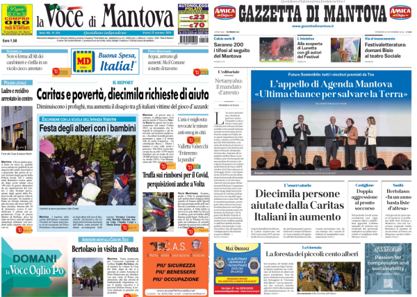 L'immagine mostra due prime pagine di giornali affiancate. A sinistra c'è "La Voce di Mantova" e a destra "Gazzetta di Mantova". Entrambi i giornali hanno articoli che parlano di temi sociali e locali.   "La Voce di Mantova" ha un titolo principale che recita: "Caritas e povertà, diecimila richieste di aiuto". Sotto il titolo c'è una foto di bambini che partecipano a un evento chiamato "Festa degli alberi con i bambini".   La "Gazzetta di Mantova" ha un titolo principale che dice: "Diecimila persone aiutate dalla Caritas. Italiani in aumento". Sotto il titolo c'è una foto di un gruppo di persone su un palco, probabilmente durante una conferenza o un evento pubblico.   Entrambi i giornali sembrano concentrarsi su temi di aiuto sociale e comunitario.  .