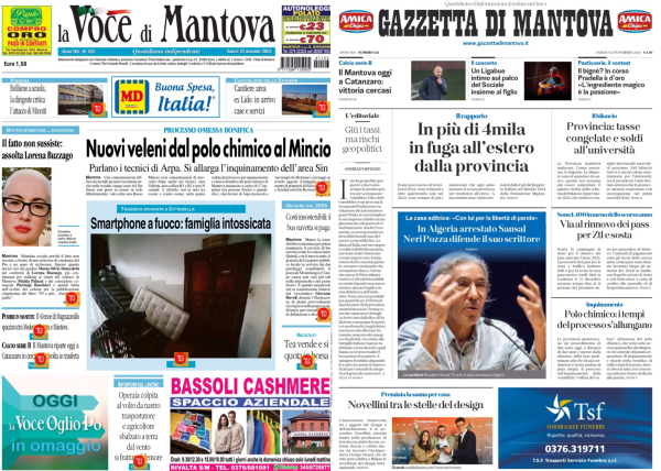 L'immagine mostra due prime pagine di giornali affiancate. A sinistra c'è "La Voce di Mantova" e a destra "Gazzetta di Mantova". Entrambe le pagine contengono vari articoli con titoli e immagini.  Nella prima pagina de "La Voce di Mantova", uno dei titoli principali è "Nuovi veleni dal polo chimico al Mincio". C'è anche un'immagine di uno smartphone con il titolo "Smartphone a fuoco: famiglia in ostaggio". In basso, c'è una pubblicità di "Bassoli Cashmere".  Nella prima pagina della "Gazzetta di Mantova", uno dei titoli principali è "In più di 4mila in fuga all'estero dalla provincia". C'è un'immagine di una persona anziana con il titolo "Moglia ritrovato senza vita. Nell'auto abbandonata una scrittura". In basso a destra, c'è una pubblicità con il logo "Tsf" e un numero di telefono.  Entrambe le pagine contengono anche altri articoli e pubblicità minori.  .