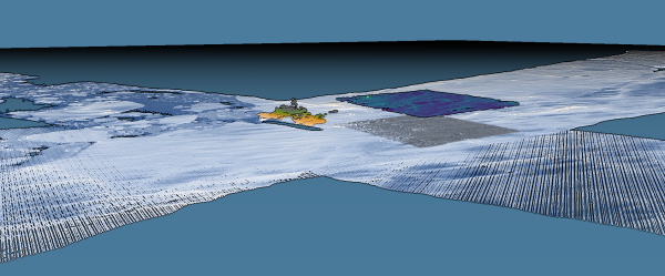 A screenshot showing lidar swaths over sea ice, coloured blue -> white by elevation, with RSV Aurora Australis near the centre, coloured orange and green. Just in front of the ship at ice level is a patch of high density points in 'real colour' from a photogrammetric survey (same aircraft), and floating above the patch in blue -> green is a terrestrial lidar scan of the same area.