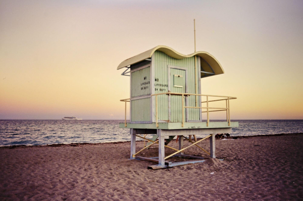 Dusk at the beach in Miami. Nobody on sigh, just a Lifeguard cabin in the center of the image.