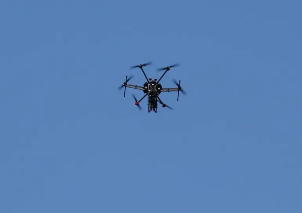 A picture from 2018 shows an Israeli quadcopter drone flying over Khan Younis in southern Gaza [File: Said Khatib/AFP]