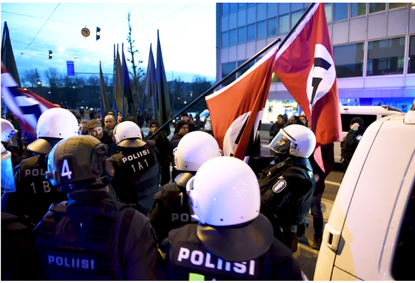 A photo about 612 march in 2018, in which the several police officers are taking swatsika flags away from the participating neo nazis. 