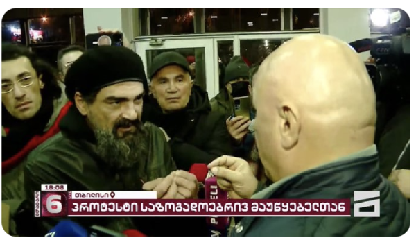 Protestors negotiate with public broadcasters in the Public TV building in Tbilisi Georgia.