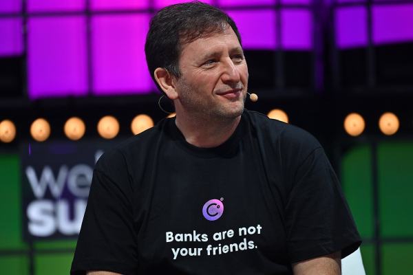 Alex Mashinsky wearing a "banks are not your friends" t-shirt onstage at WebSummit 2021