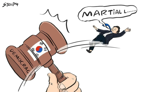 A hammer labelled democracy with a South Korean flag on it strikes against a man in a suit trying to shout "martial law"
Cartoon by Stellins