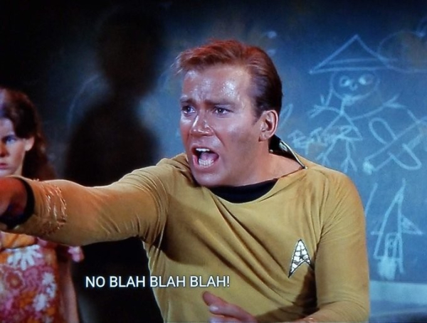 Captain James T. Kirk (circa 1968) looks alarmed and angry. He's gesturing at someone offscreen, yelling, "NO BLAH BLAH BLAH!"