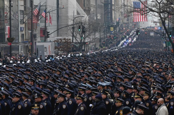 A large crowd of tens of thousands of NYPD cops.