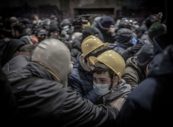 Protestors in Tbilisi, Georgia. Two protestors are picked out in a huge crowd.
Photographers description. "This was two days ago when we got very badly gassed, me and my dad. People were holding onto each other, telling each other “it’s OK” and that we have to be together and walk carefully. Then people started panicking a bit, but it was OK. People came to help us. You can see the tears in this man’s eyes, he’s scared of the teargas, but the other man in the Soviet gas mask is calming him down and helping him — emotionally and physically."