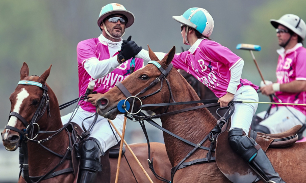 Thre polo players congratulate themselve on their well earned good fortune