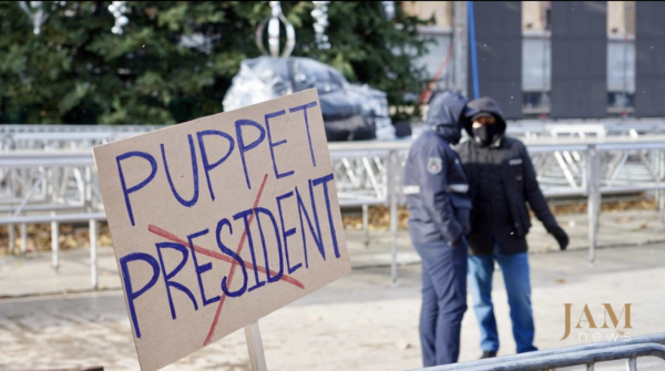 Protest banner outside parliament in Tbilisi, Georgia. It says Puppet President.