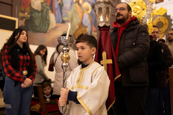 Members of the Orthodox community of Latakia attend a Sunday Mass conducted by Athanasios Fahed