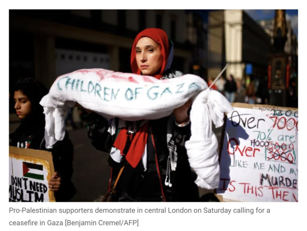 protester holding shroud labelled gaza's children