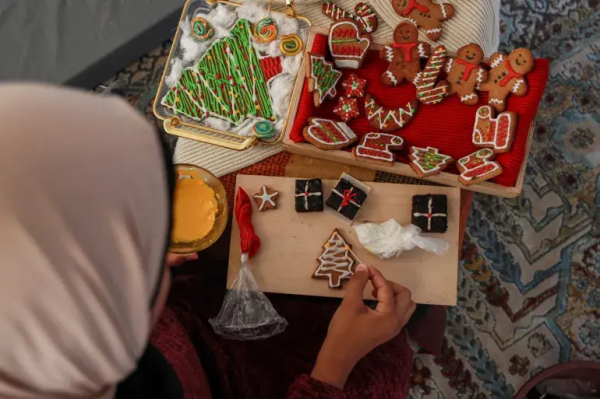 “I wanted to start the year with optimism and make Christmas cookies to distribute to the children around me in the camp,” she says as she kneads.

Making cookies was challenging because of basic food shortages that are so severe that some parts of Gaza are in famine.