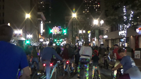 Hundreds ride bikes through the streets of Orlando three nights before New Year's Eve