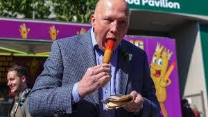 Peter Dutton failing at eating a Dagwood dog