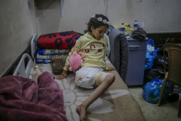 Nine-year-old Palestinian girl Heba Muhanna, who lost her leg, her father and five uncles in an Israeli air strike on the Nuseirat refugee camp on December 12, 2024 [Mohammed Saber/EPA]