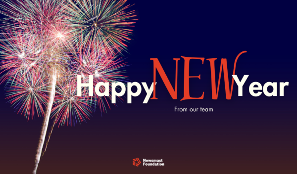 A colourful firework can be seen to the left of the frame. The copy reads: Happy New Year from our team. The Newsmast Foundation logo can be seen at the bottom.