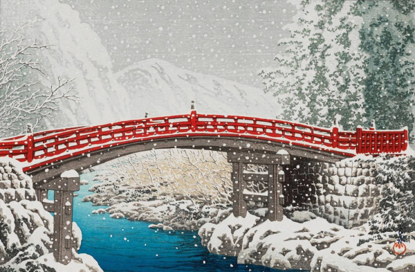 A view of Nikko's red-lacquered Kamibashi Bridge on a snowy winter's day. The bridge spans the cold-looking Daiya River in a curving arch, while on either riverbank, leafless trees and tall pines crowd together, their branches plastered with snow. Snowflakes continue to fall across the scene; beyond, low mountains are hazy and indistinct, and the sky above is overcast