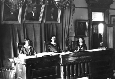 From left, Hattie Henenberg, Hortense Ward and Ruth Brazzil constituted the court in 1925.  The three white women are seated behind the judicial bench, with paintings of white men looking down at them