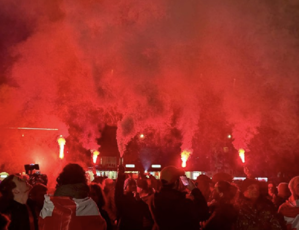 Red flare fireworks held up by protestors in Zugdidi, Georgia