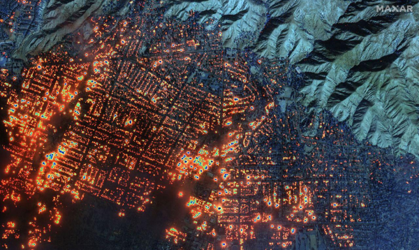 Satellite image showing an entire town consumed by fire,