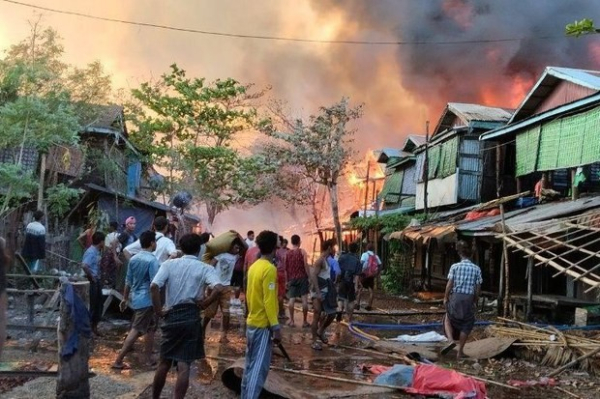 Buildings burn in Myanmar’s Kyauk Ni Maw village in Rakhine state after air force bombing on Jan. 8, 2025.
