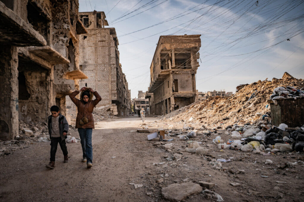 Palestinians walk on the street in Yarmouk, December 19, 2024. (Santiago Montag)