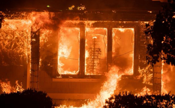 Christmas through the window of a home in Pacific Palisades CA, all engulfed in flames