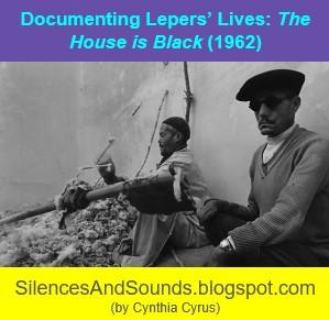 TITLE: Documenting Lepers' Lives: The House is Black (1962). Image: Two men seated on a pile of rubble. One holds a wall-attached stringed instrument and is plucking it. Both men wear hats. 