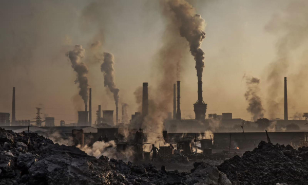 Smoke billowing into the air from a steel factory in China. Photograph: Kevin Frayer/Getty Images