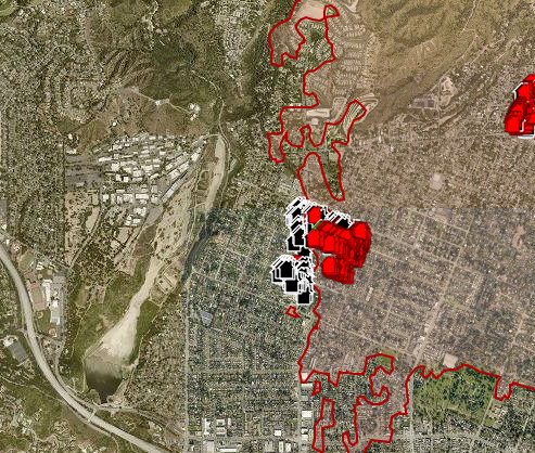 Fire on right with damage assessments ongoing, on the left, a cluster of buildings and a valley which is  NASA JPL