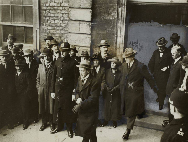 Michael Collins ‘bouncing’ out through the Chief Secretary’s door after the Handover (Courtesy of the National Library of Ireland).