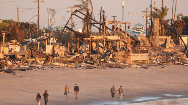 Photo: burn buildings in Caifornia with a caption Some of those worst affected by the fires were left to rebuild without thee help of insurance companies, many of whom have stopped doing business in California