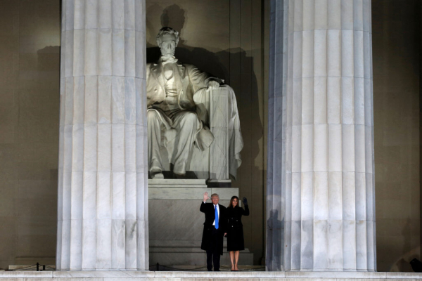 U.S. President-elect Donald Trump and his wife Melania wave at the "Make America Great Again! Welcome Celebration" at the ...