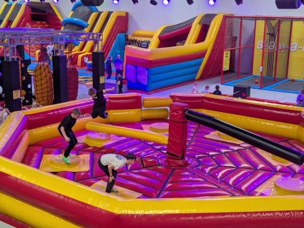 Photo of a rotating beam jump/duck game in an indoor play centre.