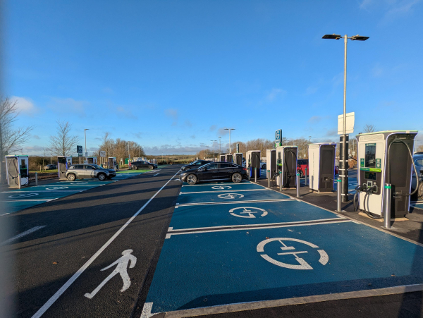 Photo of a large electric vehicle charging site.