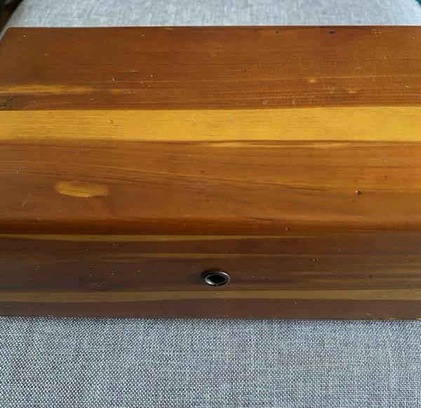 Small wooden keepsake box shown closed.