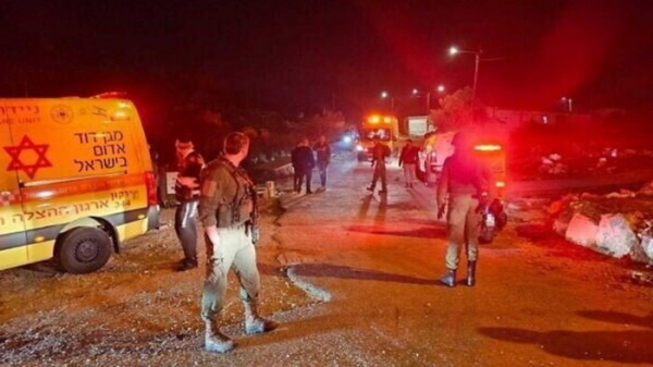 Emergency responders at the scene near the West Bank outpost of Ramat Gilad