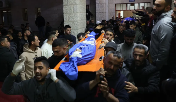 The funeral of the children killed in the drone attack in Tamun, this month. In the past, the MPI used to automatically open an investigation after the killing of Palestinians in the West Bank, but today the investigation is not opened immediately. Photo: AFP/ZAIN JAAFAR
