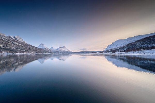 Clear skies in Grovfjord. Flat water. Hues of blue giving way to the pink and peach of dusk.