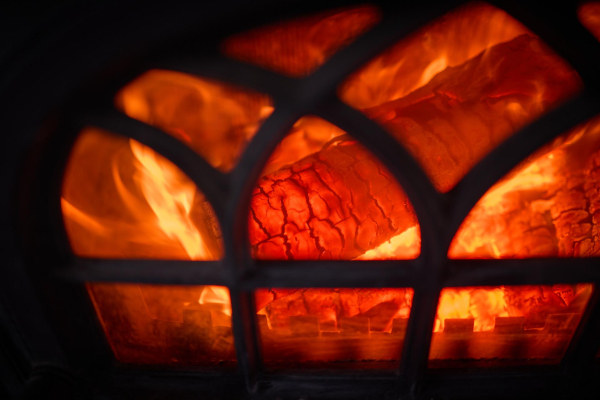 Birch wood burning hot in the iron stove.