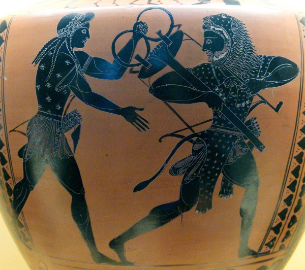 Black-figure vase painting depicting Herakles trying to steal the tripod from Apollon's temple in Delphi. The god intervenes, holding on to the tripod. We can identify Apollon by his long hair that is crowned with a laurel wreath and the bow and quiver at his hip. Herakles also wears a bow and quiver in this scene and we can't see his signature club but he is wearing the lionskin over his head, communicating clearly that this character is Herakles.